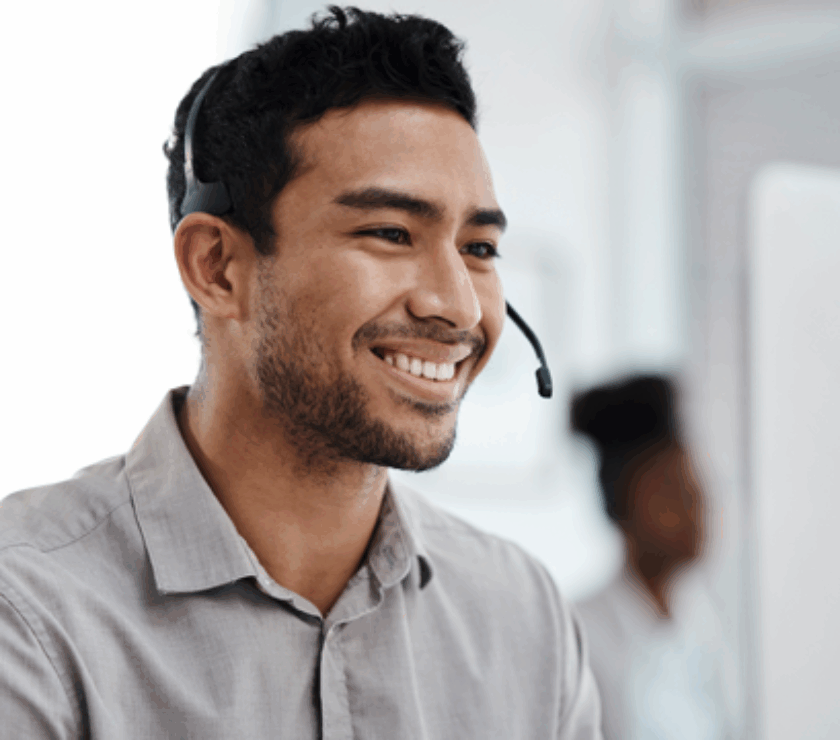 Male customer service agent on headset, smiling