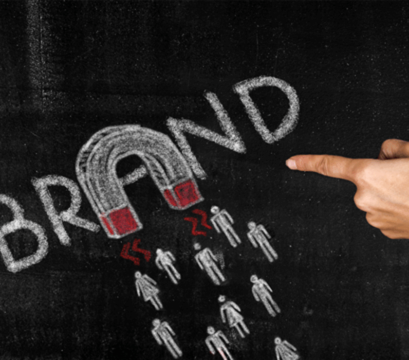 Brand in chalk with a magnet attracting customers